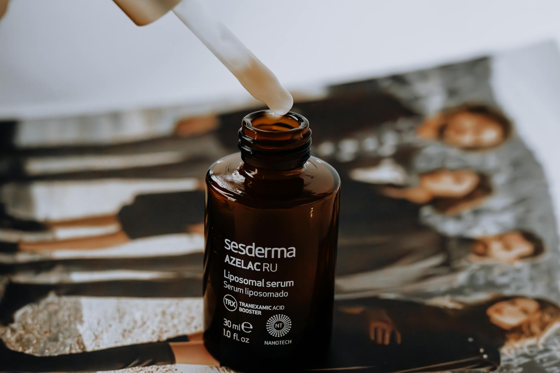 A serum bottle with a dropper, representing retinoid skincare products