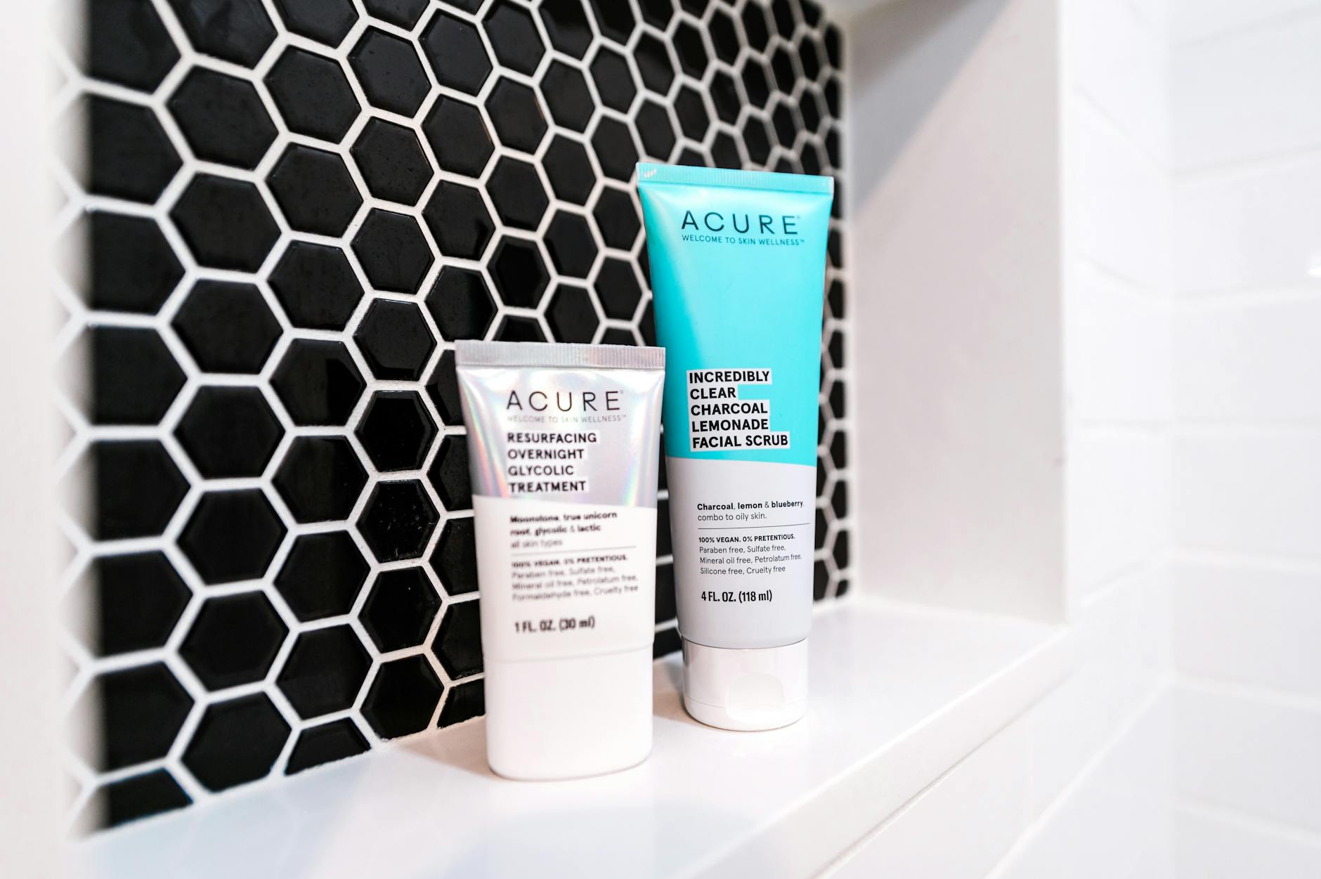 Close-up of skincare acid products arranged on a stylish dark background