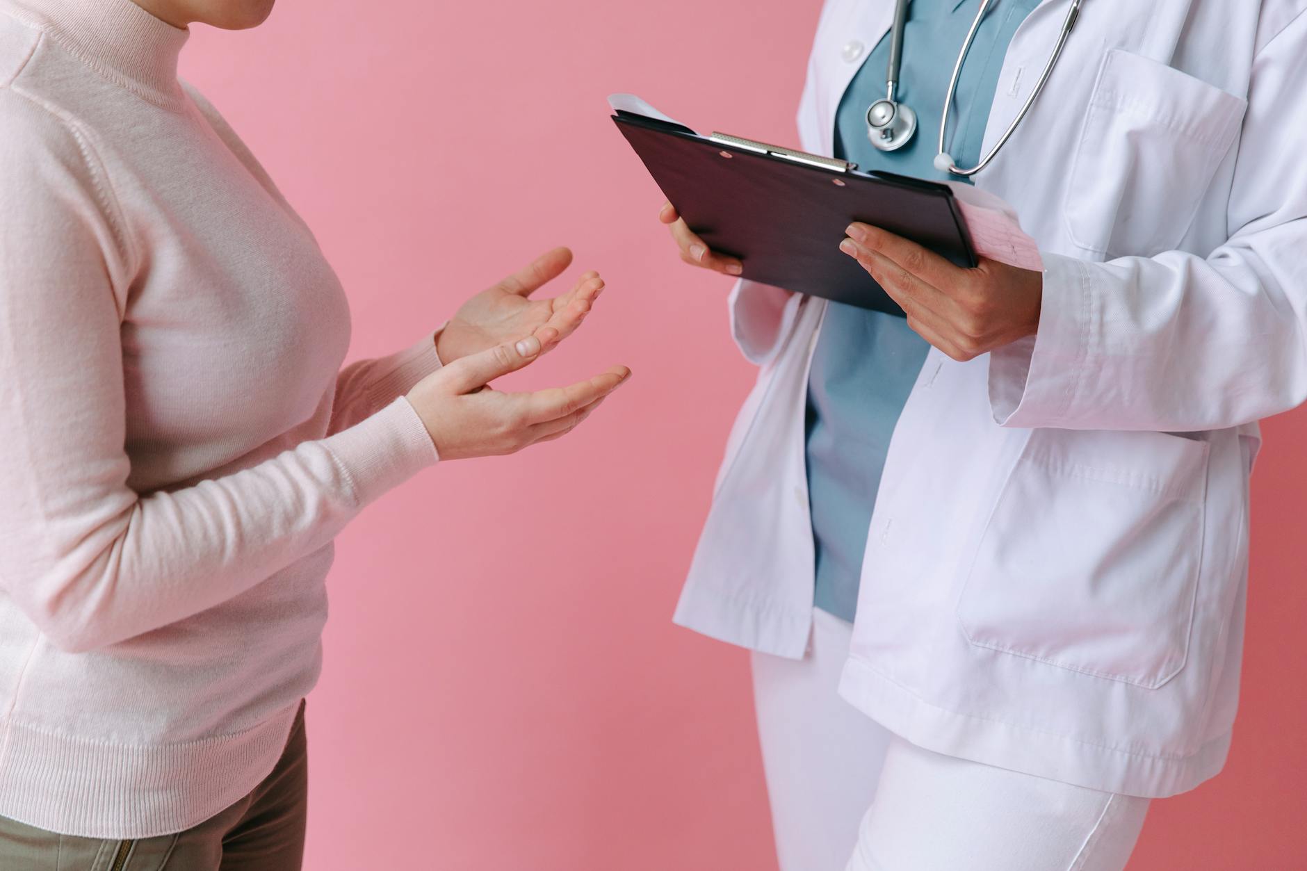 A patient discusses treatment options with their doctor during a cosmetic procedure consultation