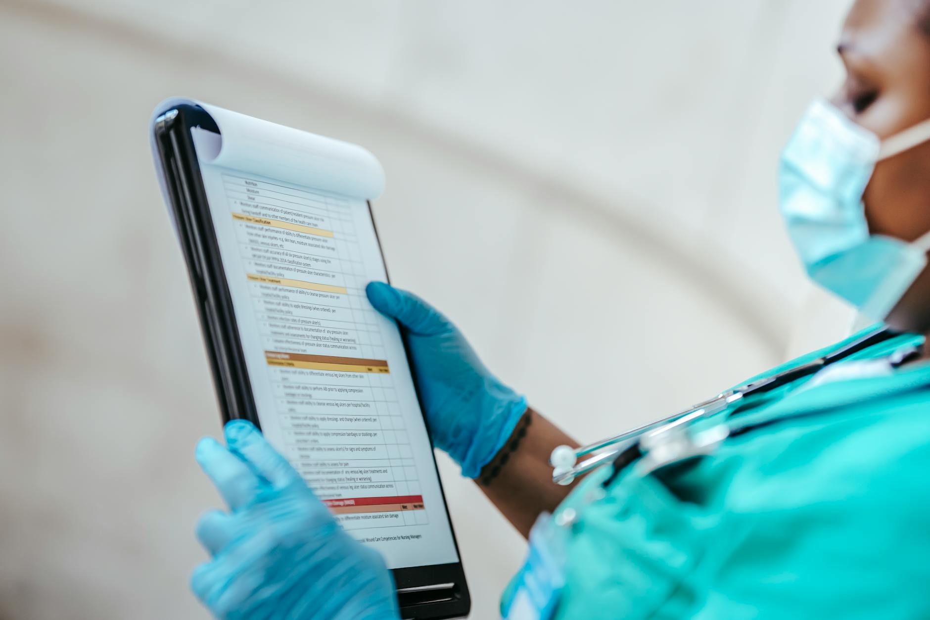 A medical professional reviews practitioner documentation and safety credentials