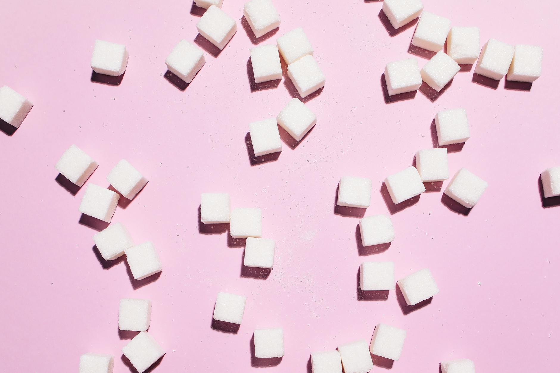 White sugar cubes representing the glycation process that accelerates skin ageing
