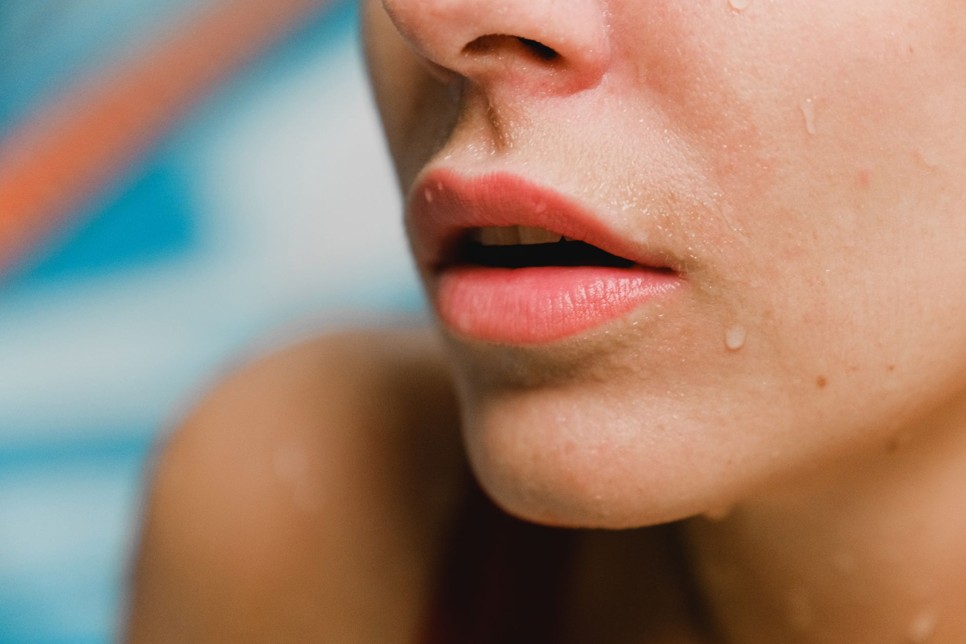 Close-up of dewy, hydrated skin with water droplets